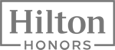 This image displays the logo for Hilton Honors, a loyalty program for the Hilton hotel chain.